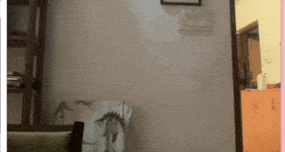 A finger pointing to the right or left with a gray rectangle covering half the screen where the finger is pointing